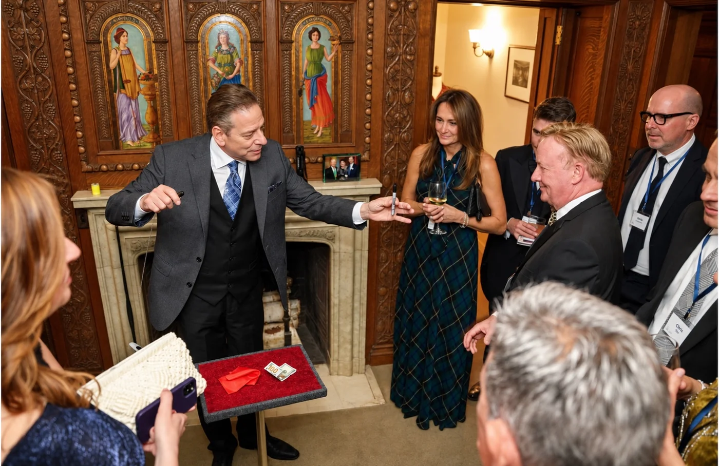 Mike Thornton performing close-up magic for guests at a private event